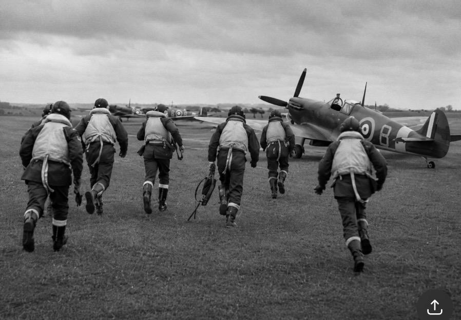 Battle of Britain pilots running to there planes spitfires and hurricanes 