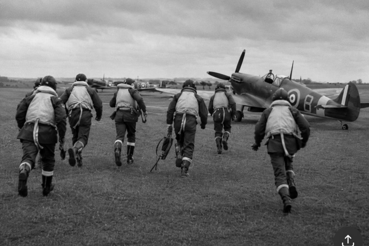 Battle of Britain pilots running to there planes spitfires and hurricanes 